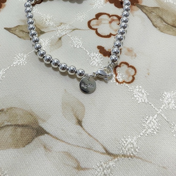 Tiffany & Co. Silver And Green Heart Bracelet - Picture 6 of 7